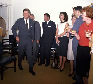 KN-C28773 29 May 1963 White House staff celebrate President John F. Kennedy's birthday with JFK and Jacqueline Kennedy in the Navy Mess Hall. Photograph by Robert Knudsen in the John F. Kennedy Presidential Library and Museum, Boston.